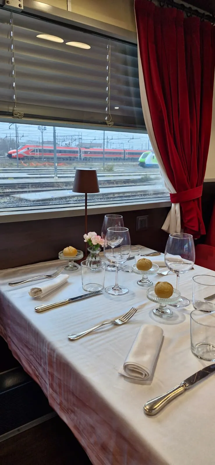 A laid table in a vintage first-class railway carriage